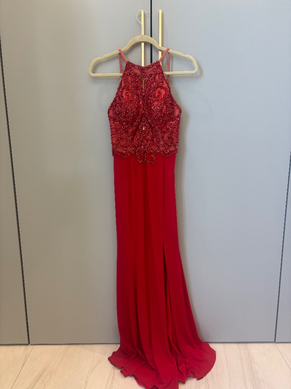 Red beaded full length prom gown